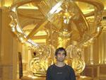 Me standing infront of an extravagant gold statue